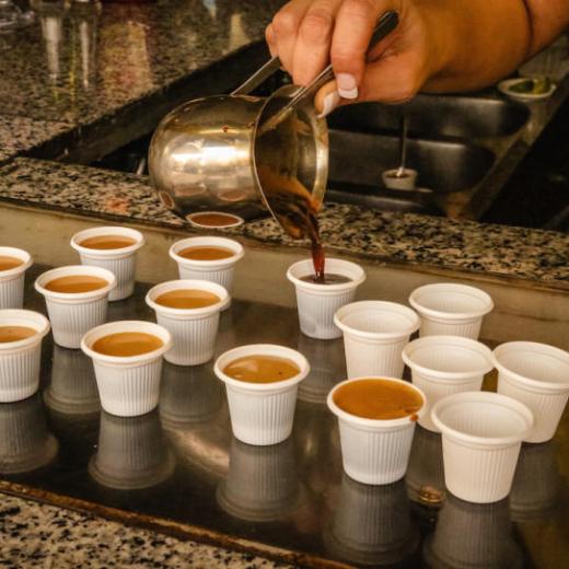 a person holding a cup of coffee