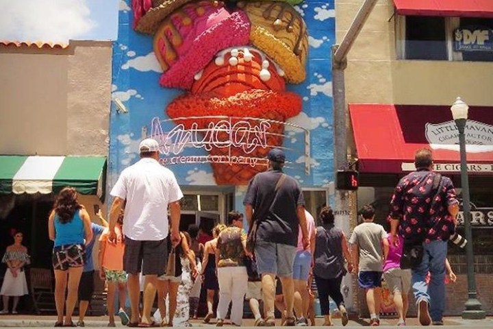 a group of people standing in front of a store