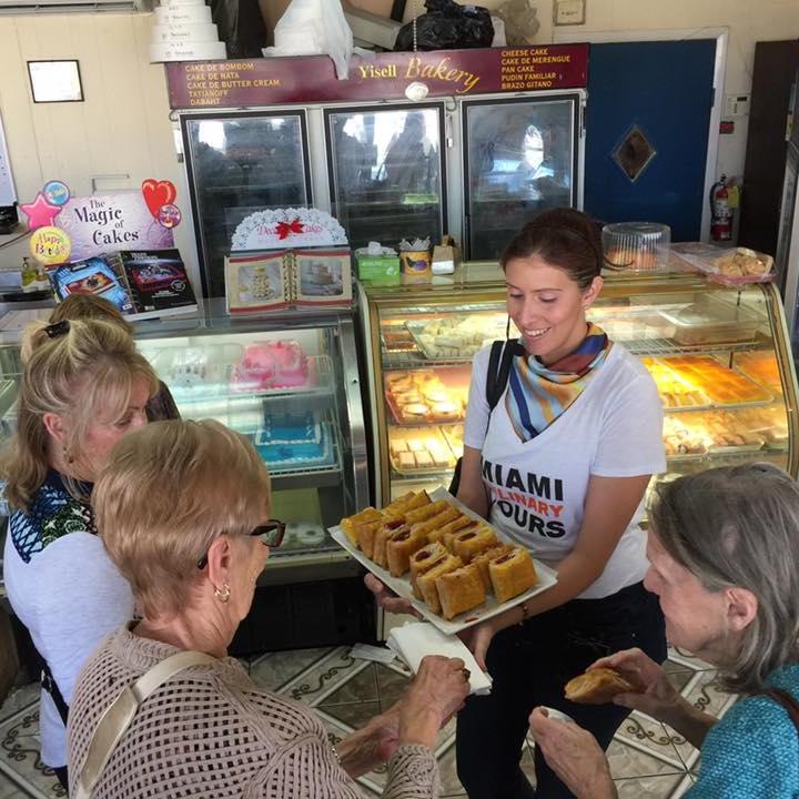 a group of people sitting in front of a store