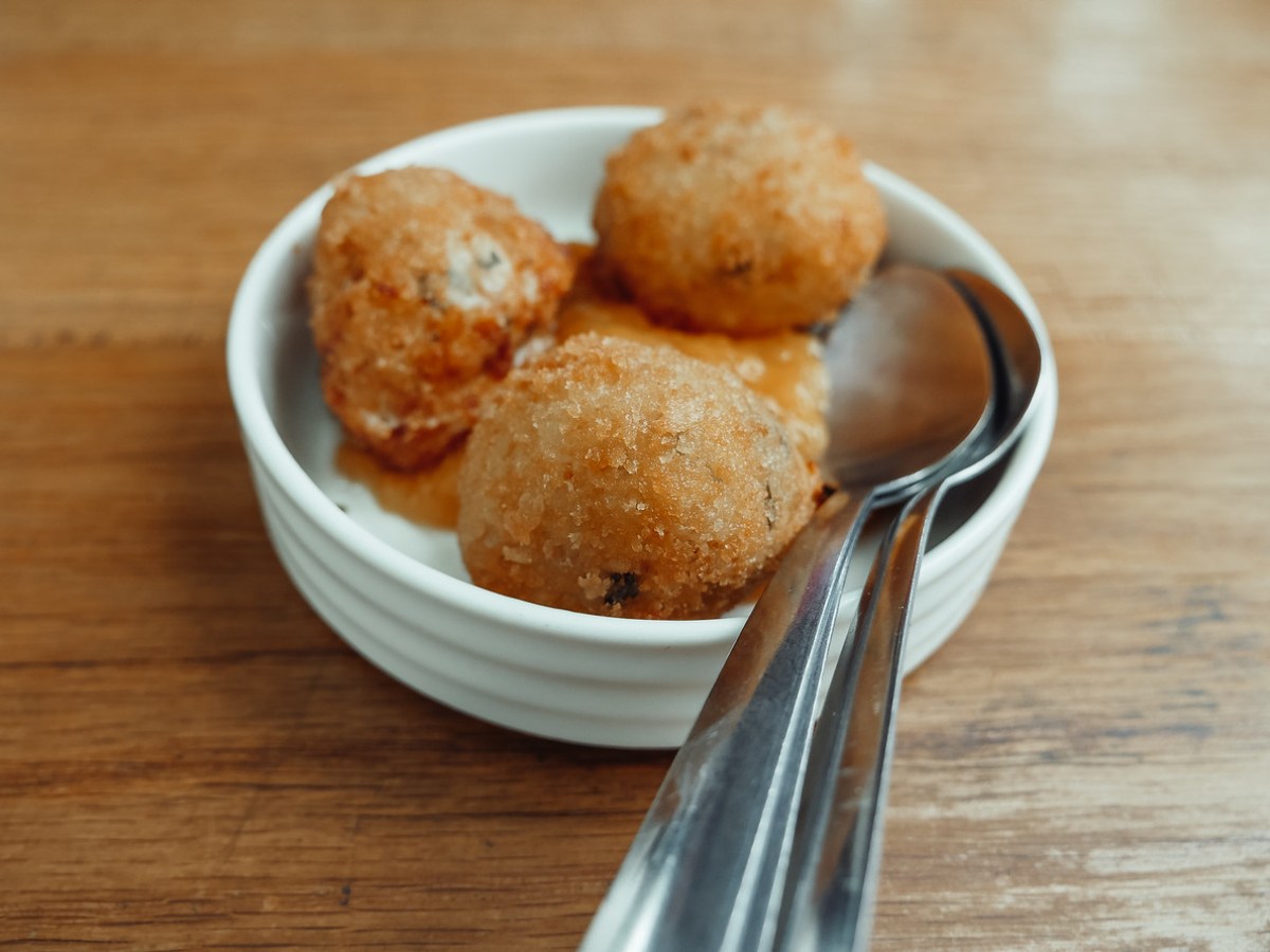 a plate of food on a wooden table