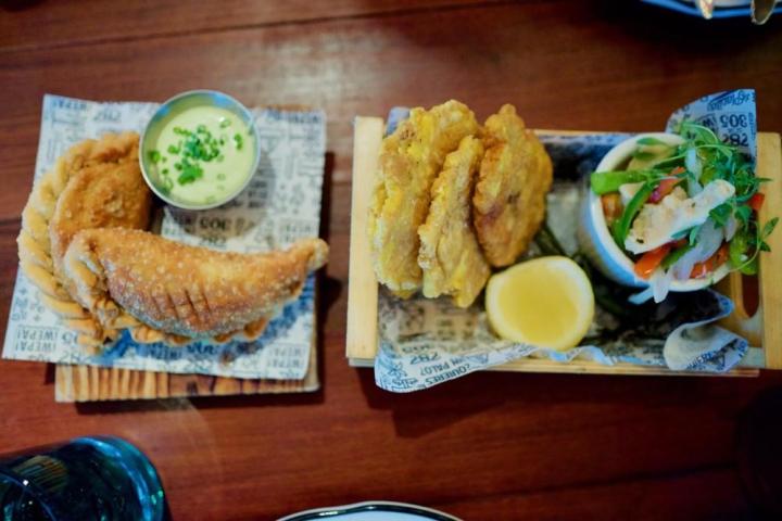 a plate of food sitting on top of a wooden table