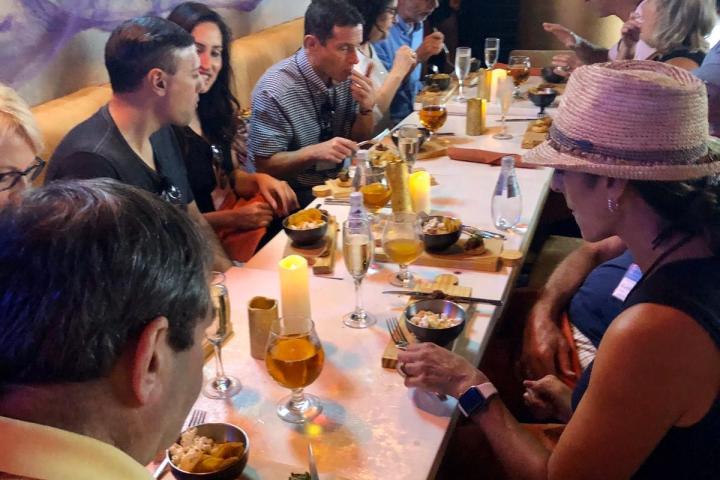a group of people sitting at a table