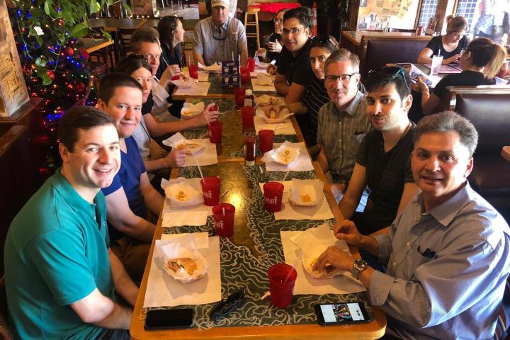 a group of people sitting at a table