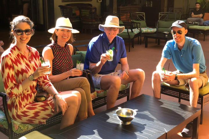 a group of people sitting around a table