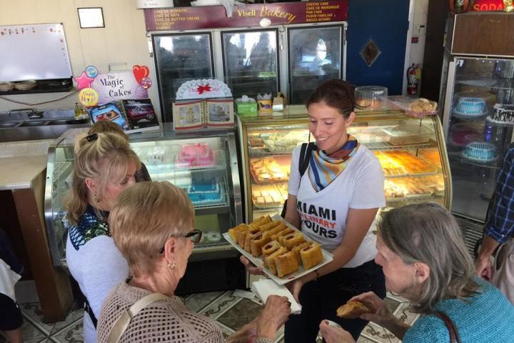 a group of people sitting in front of a store