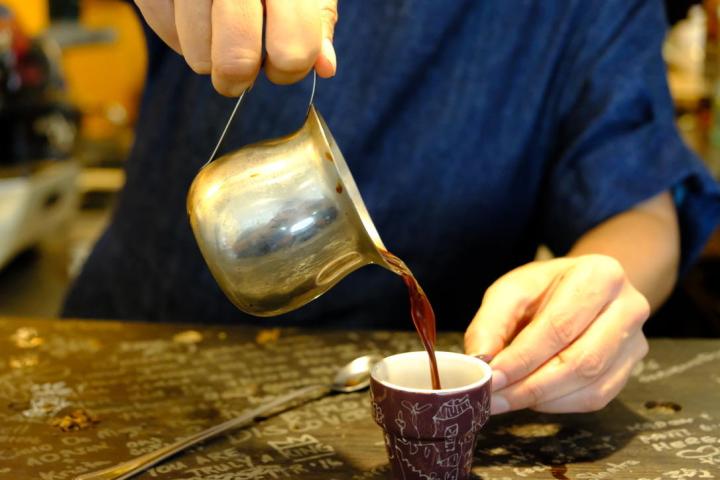 a person holding a wine glass