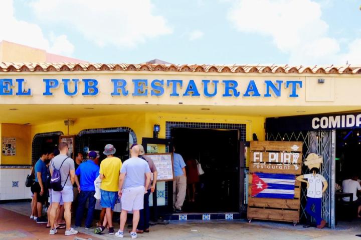 a group of people standing in front of a store